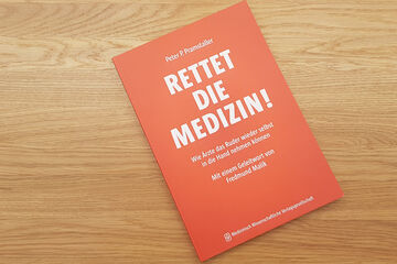 Agentur lege artis Das Buch "Rettet die Medizin" liegt auf einem Tisch