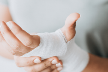 Agentur lege artis - Eine bandagierte Hand